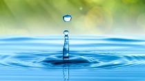 Water drop with summer scene background